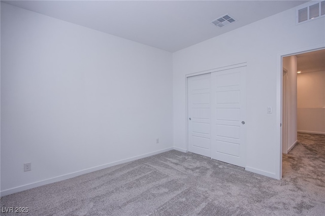 145 Aqua Commons Ln, Henderson, NV 89015 - unfurnished bedroom with carpet, baseboards, and a closet