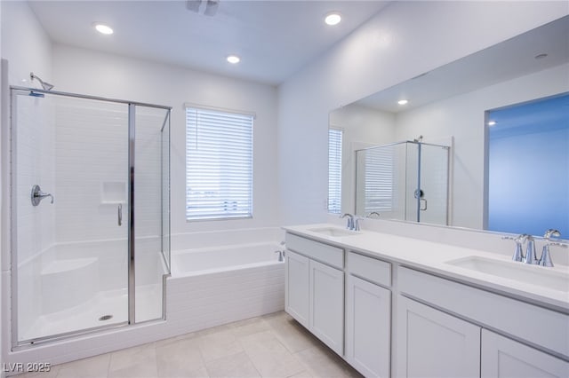 145 Aqua Commons Ln, Henderson, NV 89015 - full bathroom with a stall shower, a garden tub, tile patterned flooring, double vanity, and recessed lighting