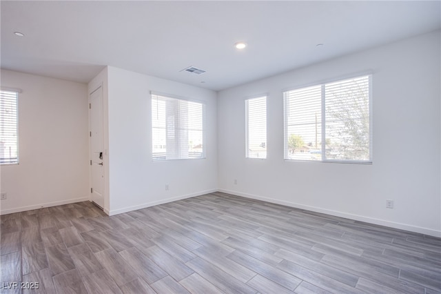 145 Aqua Commons Ln, Henderson, NV 89015 - empty room featuring wood finished floors, baseboards, and recessed lighting