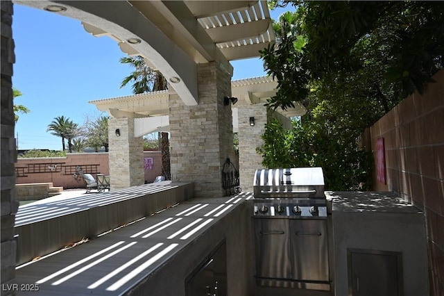 10591 Haywood Dr, Las Vegas, NV 89135 - view of patio / terrace featuring an outdoor kitchen, fence, area for grilling, and a pergola