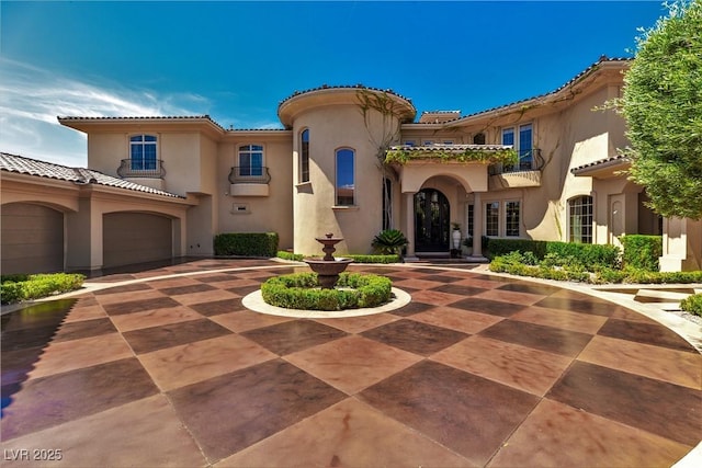 5079 Mountain Top Cir, Las Vegas, NV 89148 - mediterranean / spanish home featuring curved driveway, stucco siding, and a tiled roof