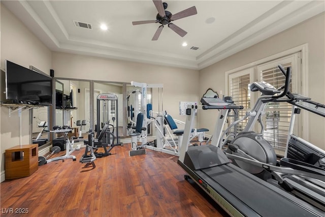5079 Mountain Top Cir, Las Vegas, NV 89148 - workout area with wood finished floors, a ceiling fan, and a tray ceiling