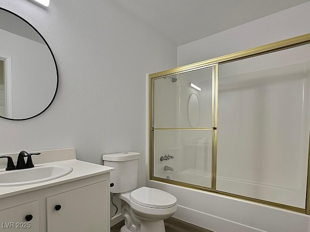 full bath featuring vanity, toilet, and enclosed tub / shower combo