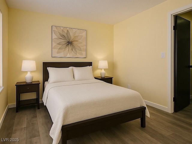 bedroom featuring wood finished floors and baseboards
