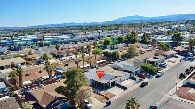 aerial view of residential area featuring a mountain backdrop