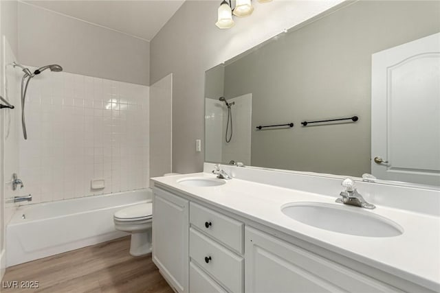 432 Emerald Heights St, Las Vegas, NV 89144 - full bathroom featuring toilet, wood finished floors, bathing tub / shower combination, and double vanity