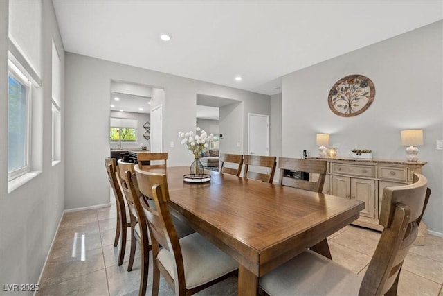 dining space with light tile patterned flooring, baseboards, and recessed lighting