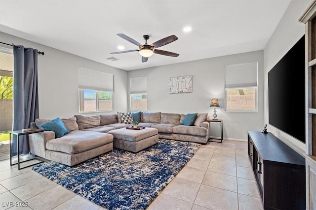 living room featuring ceiling fan, light tile patterned floors, recessed lighting, and baseboards