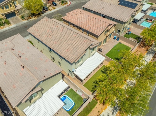 aerial perspective of suburban area with a pool area