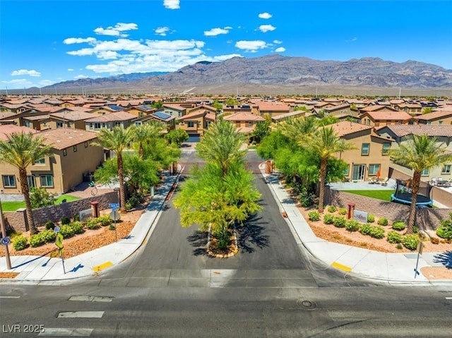 aerial perspective of suburban area featuring a mountain backdrop