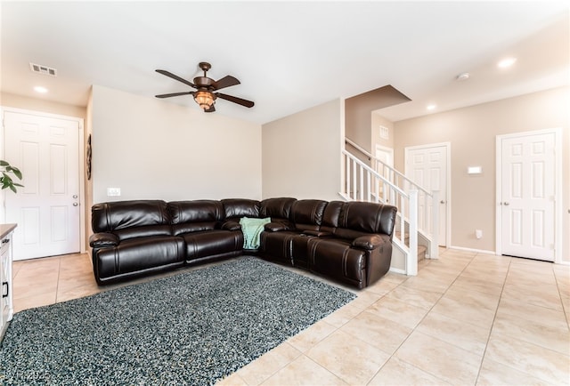living room with light tile patterned floors, ceiling fan, stairs, and recessed lighting