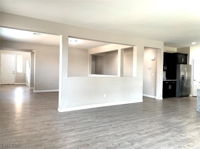 7861 Hamilton Pool Dr, Las Vegas, NV 89113 - unfurnished living room featuring baseboards and wood finished floors