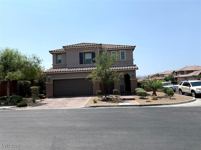 7861 Hamilton Pool Dr, Las Vegas, NV 89113 - mediterranean / spanish home with stucco siding, a garage, and decorative driveway