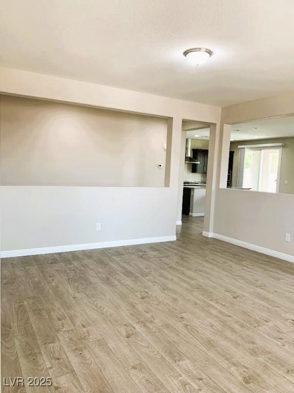 7861 Hamilton Pool Dr, Las Vegas, NV 89113 - unfurnished room featuring light wood-type flooring and baseboards