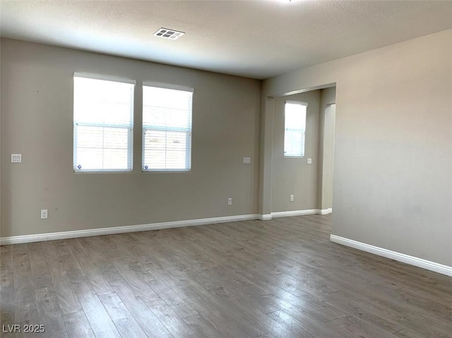 7861 Hamilton Pool Dr, Las Vegas, NV 89113 - spare room with wood finished floors and baseboards