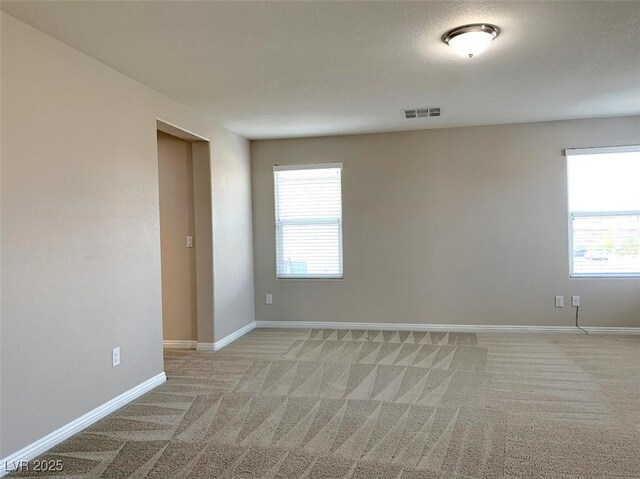 7861 Hamilton Pool Dr, Las Vegas, NV 89113 - empty room with light carpet and baseboards