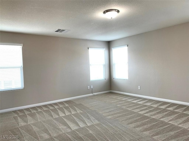 7861 Hamilton Pool Dr, Las Vegas, NV 89113 - spare room featuring light carpet, baseboards, and a textured ceiling