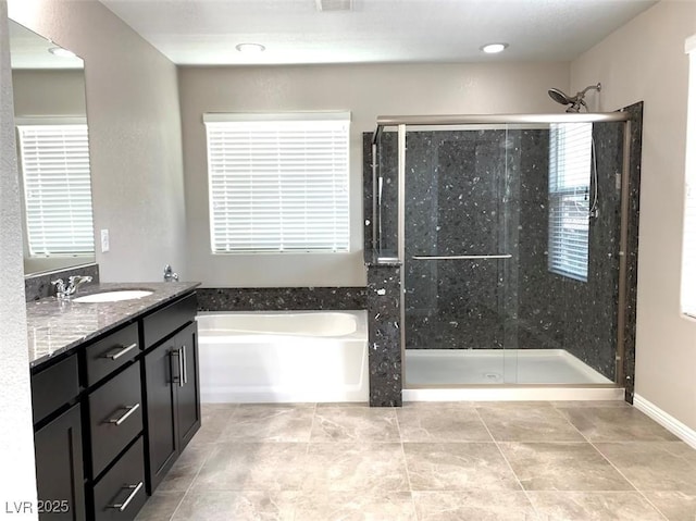 7861 Hamilton Pool Dr, Las Vegas, NV 89113 - full bath featuring a stall shower, a bath, vanity, and tile patterned flooring