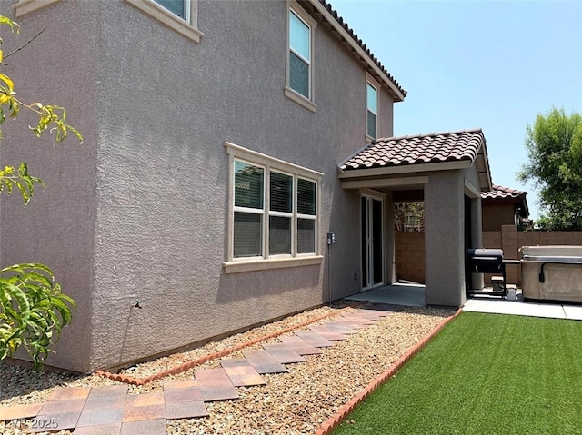 7861 Hamilton Pool Dr, Las Vegas, NV 89113 - rear view of house with stucco siding, a tile roof, a patio area, and fence