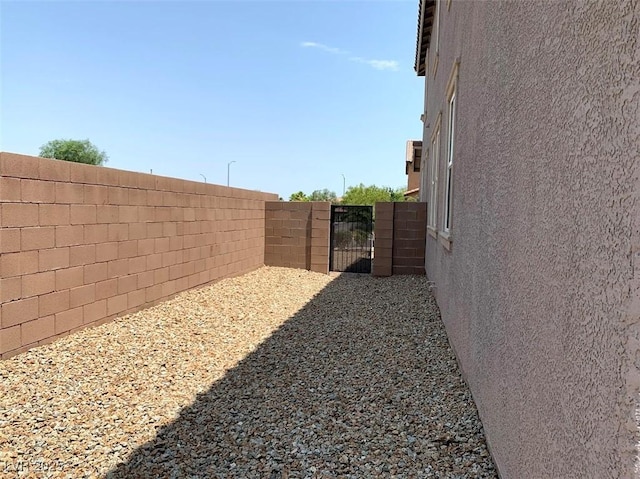 7861 Hamilton Pool Dr, Las Vegas, NV 89113 - view of yard featuring fence and a gate