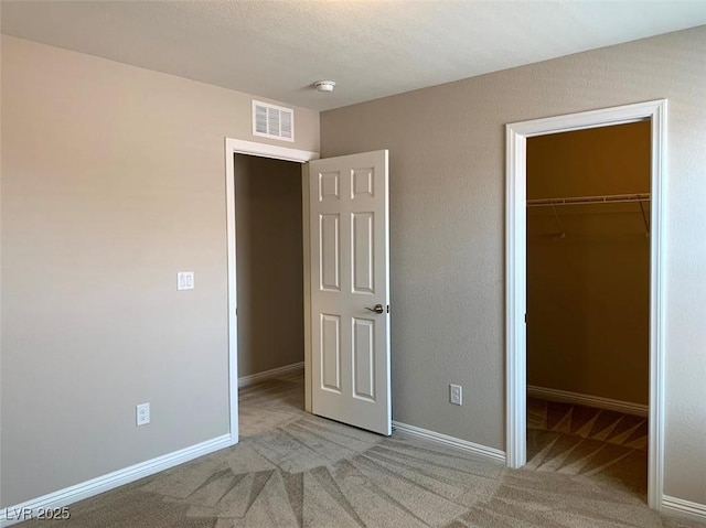 7861 Hamilton Pool Dr, Las Vegas, NV 89113 - unfurnished bedroom featuring carpet floors, a spacious closet, baseboards, and a closet