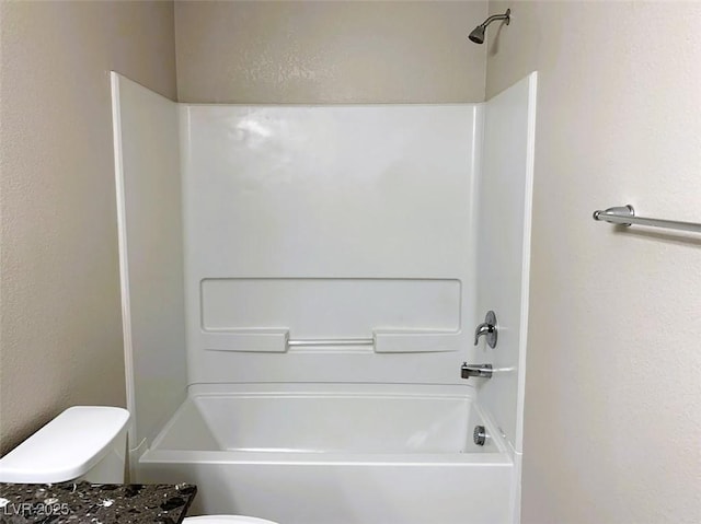7861 Hamilton Pool Dr, Las Vegas, NV 89113 - bathroom with shower / washtub combination, toilet, and a textured wall