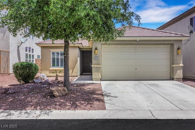 8836 Martin Downs Pl, Las Vegas, NV 89131 - view of front facade featuring concrete driveway, stucco siding, an attached garage, and a tile roof