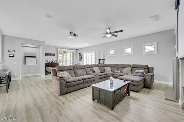 8836 Martin Downs Pl, Las Vegas, NV 89131 - living room with light wood-style floors, ceiling fan, and baseboards