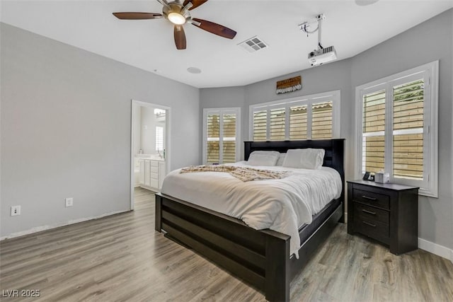 8836 Martin Downs Pl, Las Vegas, NV 89131 - bedroom featuring wood finished floors, baseboards, and ensuite bathroom