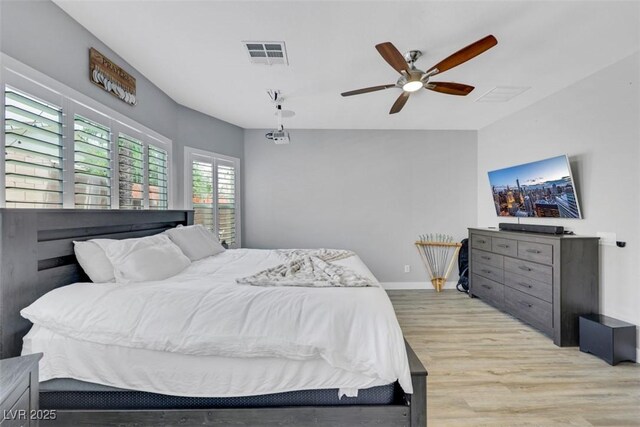 8836 Martin Downs Pl, Las Vegas, NV 89131 - bedroom with light wood-style flooring, a ceiling fan, and baseboards