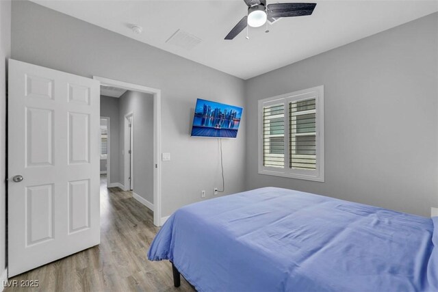 8836 Martin Downs Pl, Las Vegas, NV 89131 - bedroom with wood finished floors, baseboards, and ceiling fan