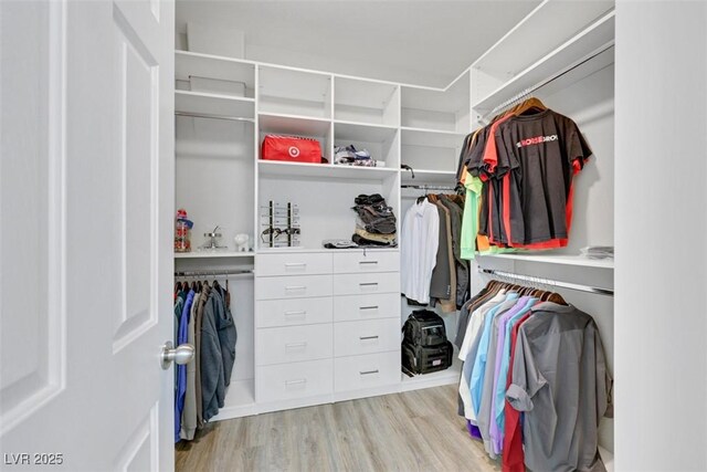 8836 Martin Downs Pl, Las Vegas, NV 89131 - walk in closet featuring light wood finished floors