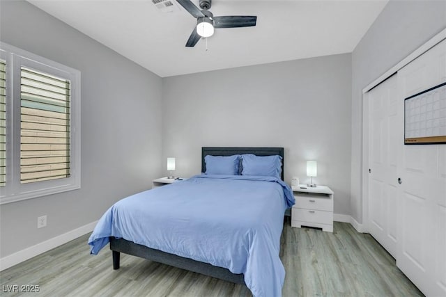 8836 Martin Downs Pl, Las Vegas, NV 89131 - bedroom with light wood-style floors, baseboards, and a closet