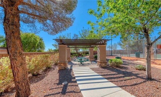 8836 Martin Downs Pl, Las Vegas, NV 89131 - view of community featuring fence, a tennis court, and a pergola