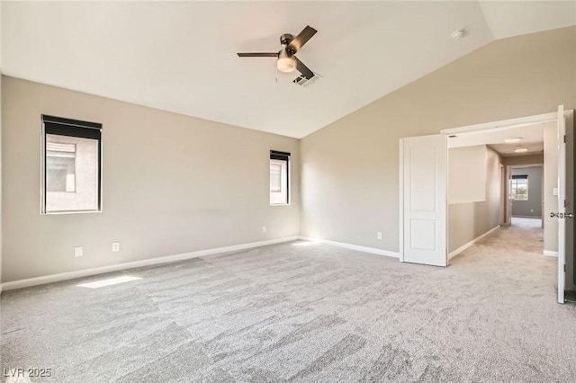 8469 Cheerful Brook Ave, Las Vegas, NV 89143 - spare room featuring a ceiling fan, lofted ceiling, light colored carpet, baseboards, and a smoke detector