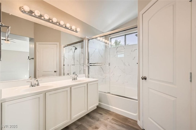 8469 Cheerful Brook Ave, Las Vegas, NV 89143 - bathroom with lofted ceiling, wood finished floors, combined bath / shower with glass door, and double vanity