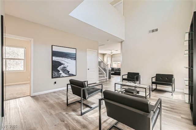 8469 Cheerful Brook Ave, Las Vegas, NV 89143 - living area with light wood-type flooring, baseboards, and healthy amount of natural light