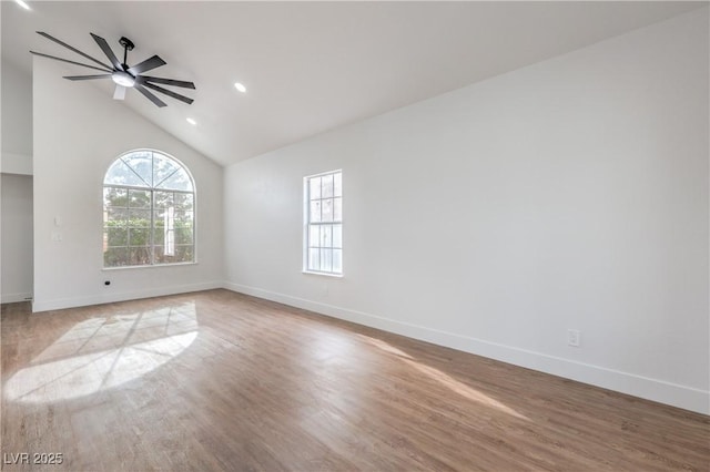 2107 Fountain Springs Dr, Henderson, NV 89074 - empty room with healthy amount of natural light, baseboards, wood finished floors, a ceiling fan, and high vaulted ceiling