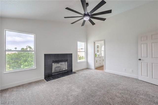 2107 Fountain Springs Dr, Henderson, NV 89074 - unfurnished living room with plenty of natural light, carpet, ceiling fan, and vaulted ceiling