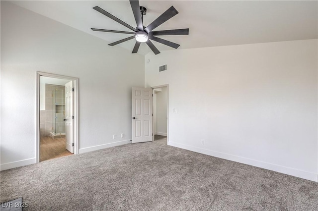2107 Fountain Springs Dr, Henderson, NV 89074 - unfurnished bedroom with carpet floors, baseboards, connected bathroom, ceiling fan, and high vaulted ceiling