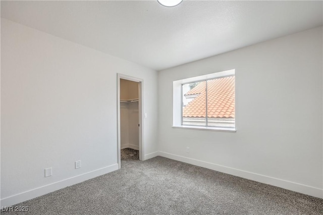2107 Fountain Springs Dr, Henderson, NV 89074 - unfurnished bedroom featuring carpet floors, baseboards, a walk in closet, and a closet