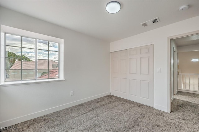 2107 Fountain Springs Dr, Henderson, NV 89074 - unfurnished bedroom with carpet flooring, a closet, and baseboards