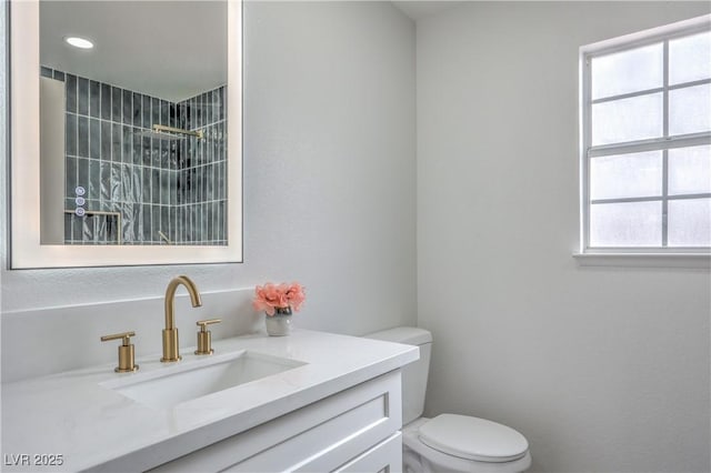 2107 Fountain Springs Dr, Henderson, NV 89074 - full bathroom featuring toilet, vanity, and a tile shower