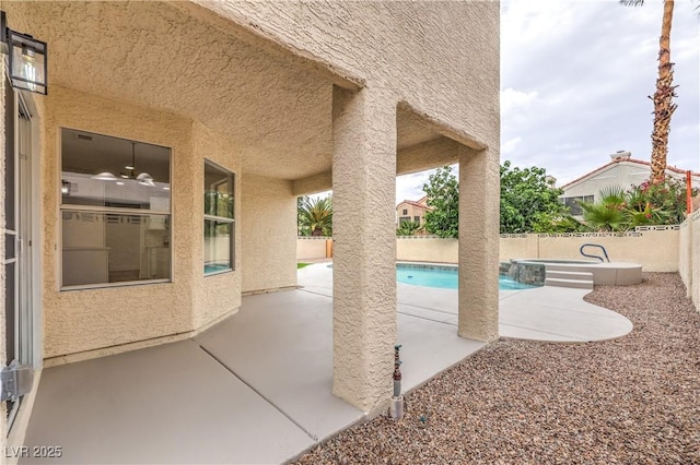 2107 Fountain Springs Dr, Henderson, NV 89074 - view of swimming pool with a pool with connected hot tub, a patio area, and a fenced backyard