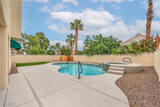 2107 Fountain Springs Dr, Henderson, NV 89074 - view of swimming pool featuring a patio area, a pool with connected hot tub, and a fenced backyard