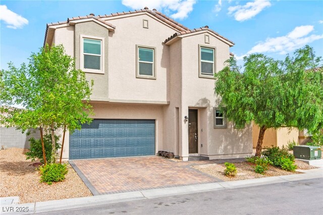 2672 Painted Mist Ct, Las Vegas, NV 89142 - view of front of property with stucco siding, a tile roof, a garage, and decorative driveway
