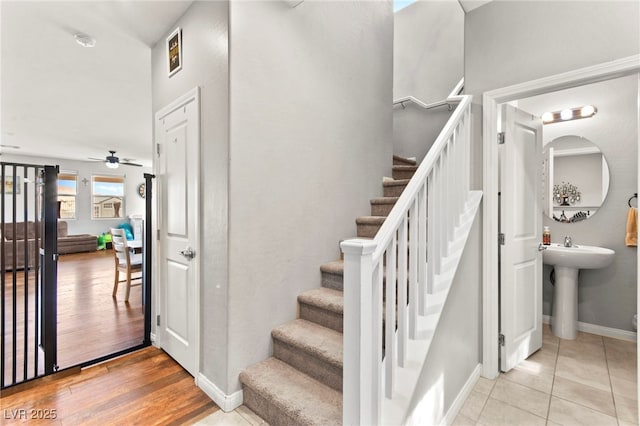2672 Painted Mist Ct, Las Vegas, NV 89142 - stairway with baseboards, ceiling fan, and tile patterned floors