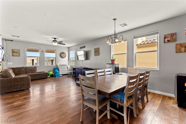 2672 Painted Mist Ct, Las Vegas, NV 89142 - dining space featuring hardwood / wood-style flooring, ceiling fan, a chandelier, and baseboards