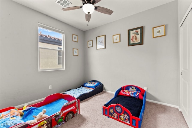 2672 Painted Mist Ct, Las Vegas, NV 89142 - bedroom with carpet flooring, a closet, baseboards, and ceiling fan