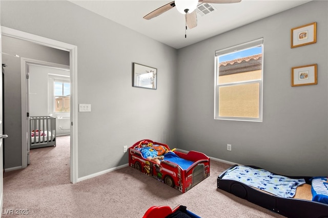 2672 Painted Mist Ct, Las Vegas, NV 89142 - carpeted bedroom with baseboards and a ceiling fan